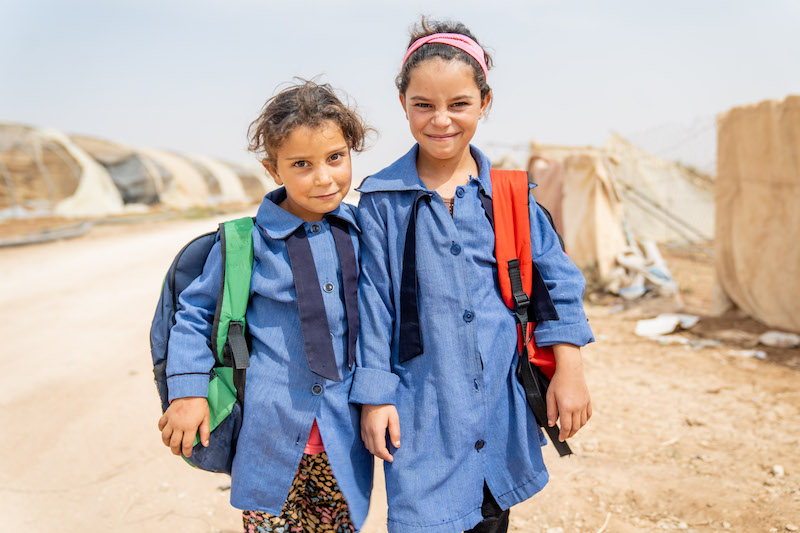 Mariam, 6 years, and her sister Malak, 9 years, are Syrian refugees living in an informal tented settlement in Jordan.

“We’re going to school on a bus and we’re going to study,” says Malak. “I like school. I need to keep going so I can grow up and become a teacher. 

“If they don’t bring us buses, we won’t be able to go to school. Once the bus comes I will direct my little sister. I will tell her to sit down and pay attention to the driver.” 

“I go to school on the bus with all these boys and girls,” says Mariam in the Makani ‘My Space’ centre in the informal tented settlement where she lives. “School is beautiful because there we receive an education.”

In September 2018, UNICEF warned that, due to a lack of funding, school transportation services for vulnerable children in remote areas would end in the 2018/19 academic year. Only a few weeks into the school year, the lack of transport services for children living in informal tented settlements (ITS), who live long distances from public schools, was already having a serious impact on the education of some of the most vulnerable children in Jordan who missed up to three weeks of school. On 30 September 2018, UNICEF resumed school transport for 1,800 children living in ITS thanks to generous support from the Government of Germany and US PRM. Funding gaps mean that there are still 800 children in informal tented settlements and close to 3,000 children in host communities not receiving much-needed school transport services this year. It costs an average of 40 JOD (US$56) per child a month to provide transport to and from school. 

UNICEF programming supports enrolling out of school children in public school by referring them to certified education (formal school or non-formal Catch-Up Program or Drop-Out Program) and supporting their retention. In addition to supporting integration between the children from vulnerable groups and their communities.

Approximately 20,000 Syrians in Jordan